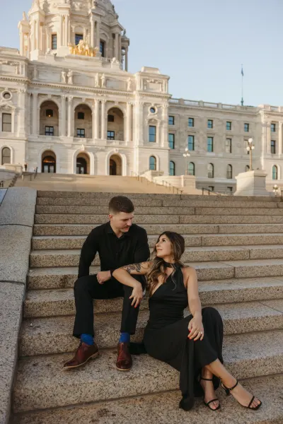 Couple sitting on state capitol steps at golden hour — Edina, Minnesota wedding photography by Emma Ziegler, Honey Deww Photography