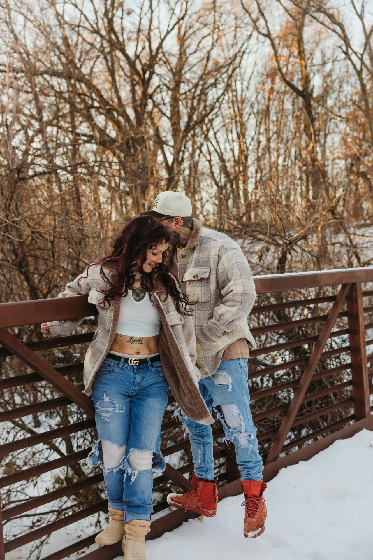 Tattooed couple in plaid flannels on snowy bridge — Twin Cities couples & engagement photographer Emma Ziegler, Honeydew Photography (Minneapolis, Minnesota)