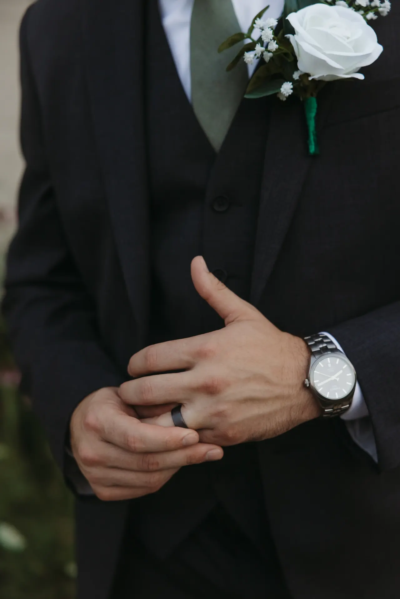 Groom turning his new wedding ring, watch and white rose boutonniere in frame — Minneapolis & Twin Cities wedding photography by Emma Ziegler, Honey Deww Photography (Minnesota)