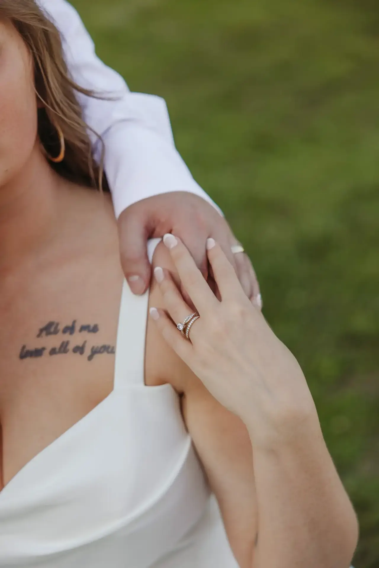 A tattoo reading "All of me loves all of you" beside a hand wearing a wedding ring — Minneapolis & Twin Cities wedding photography by Emma Ziegler, Honey Deww Photography (Minnesota)